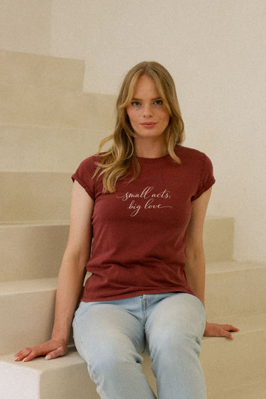 "Small Acts" Roll With It Tee Cursive Front