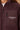 Close-up of the Om & Ah London logo on the Washed Plum Signature Sherpa