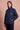 Signature Sherpa in French Navy with the Om & Ah London logo, front view