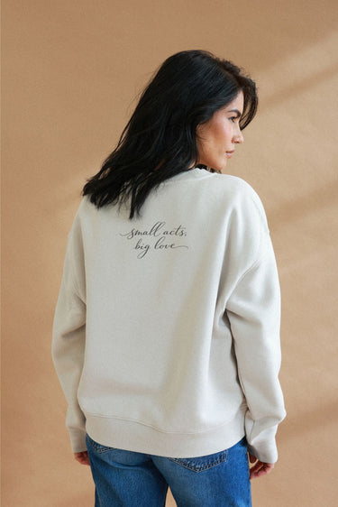 "Small Acts" Slumber Sweater Cursive Back