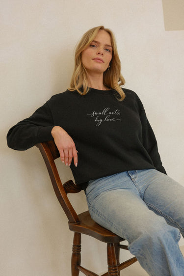 "Small Acts" Slumber Sweater Cursive Front